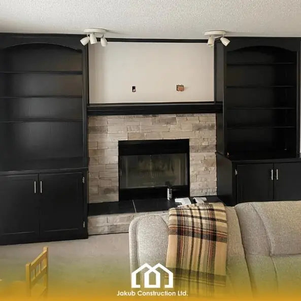 Painted living room built-in cabinets around fireplace in Riverbend Calgary